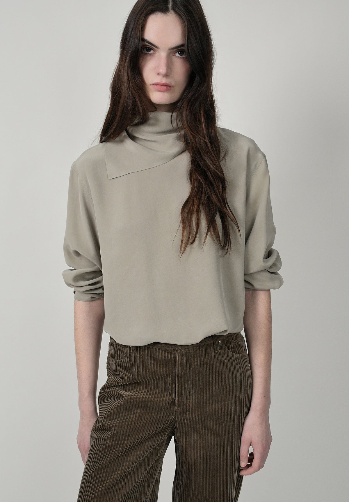 Almond green silk tie-neck blouse